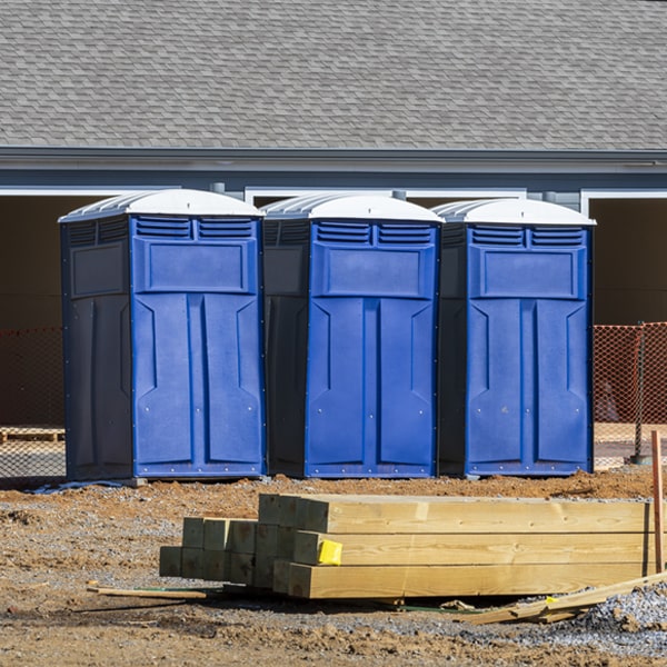 what is the cost difference between standard and deluxe portable toilet rentals in Dixie